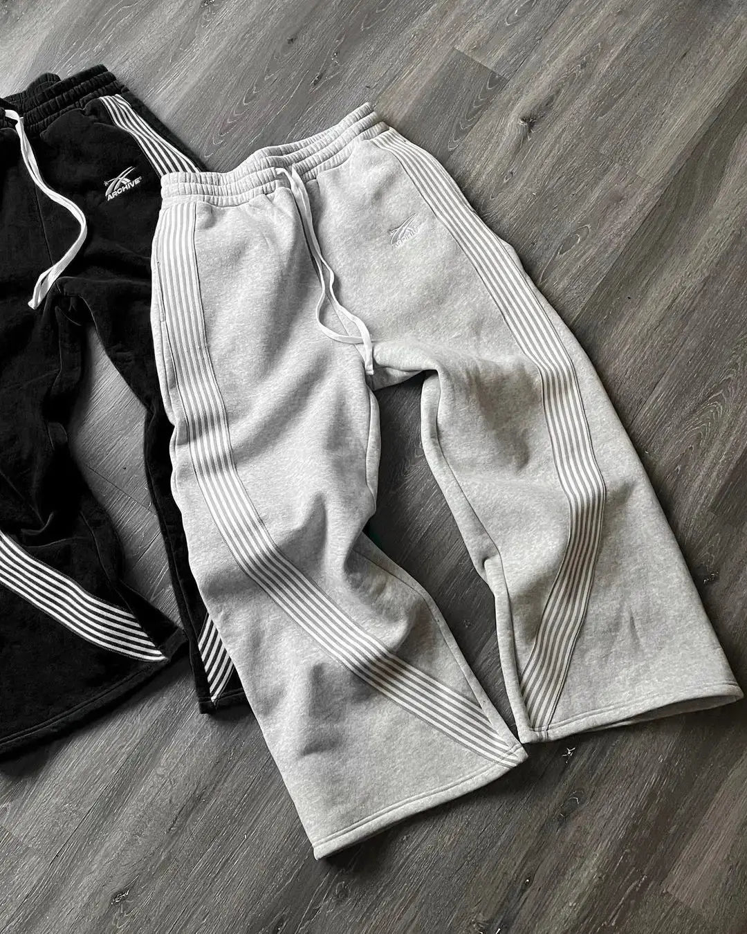 Sporty men's athletic joggers with retro side stripes, ideal for workouts or streetwear comfort.
