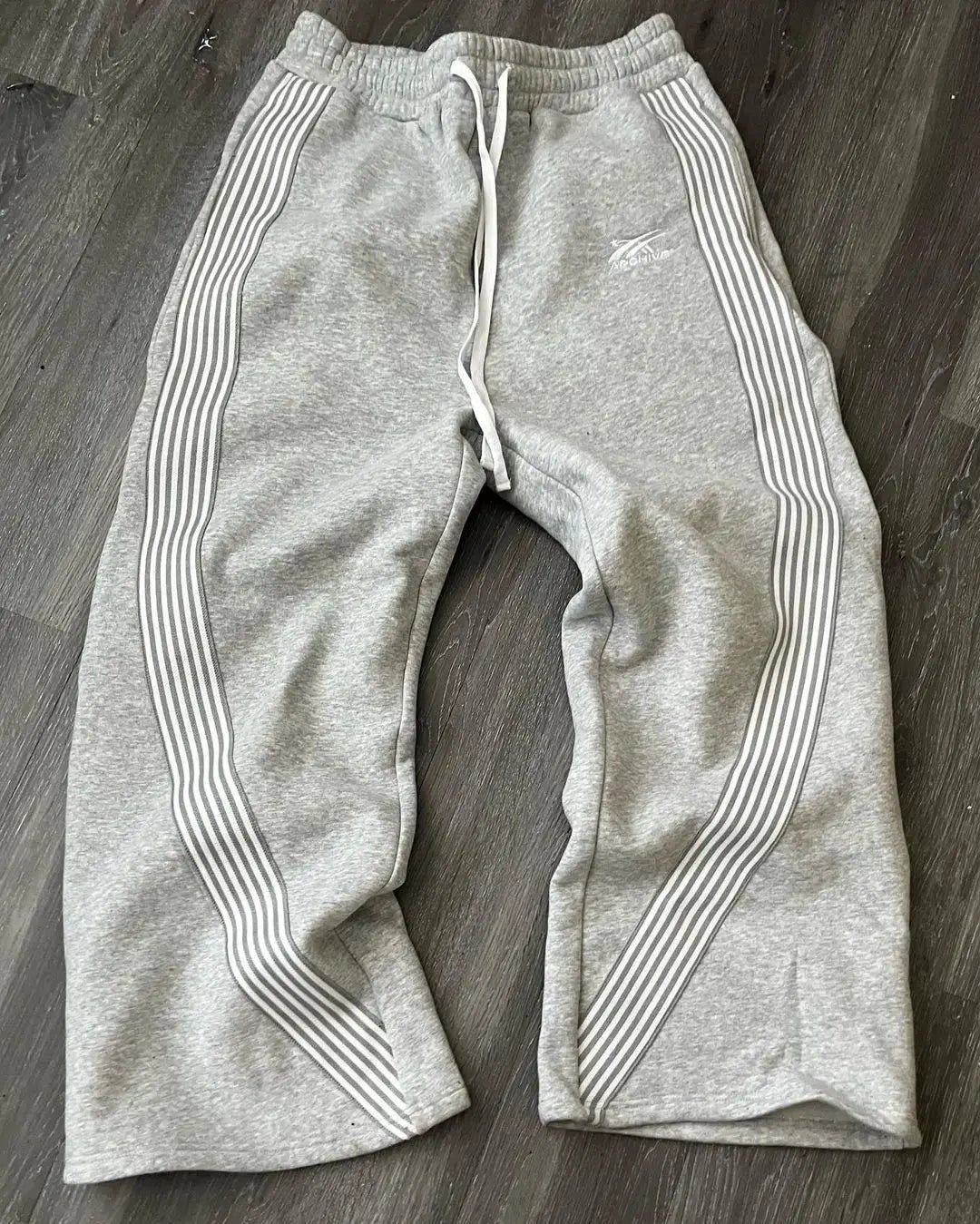 Soft men's casual joggers with retro stripes. Versatile sweatpants for active comfort & daily wear.