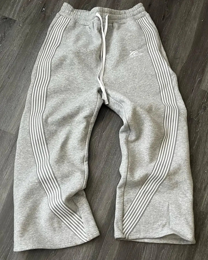 Soft men's casual joggers with retro stripes. Versatile sweatpants for active comfort & daily wear.