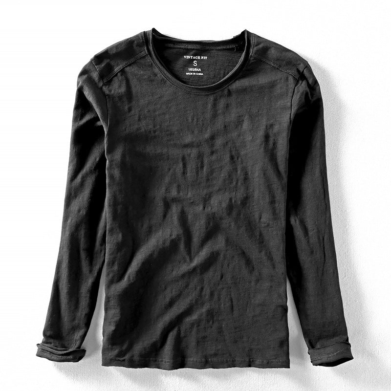 Front view of a men's long sleeve crew neck textured top, suitable for smart casual fashion.
