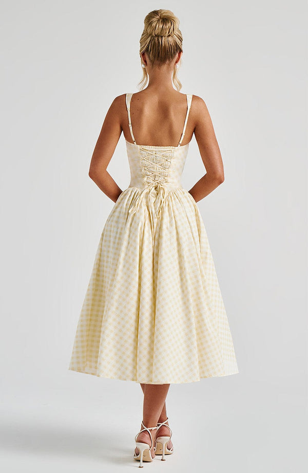 Stylish Gingham Midi Dress for women. Features elegant square neck, sleeveless design, perfect for warm weather and day wear.