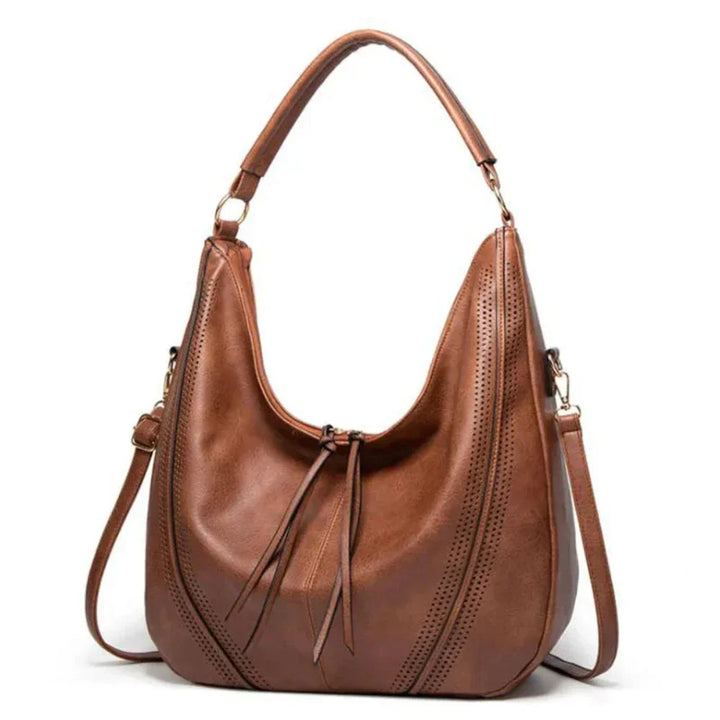 Classic women's vintage leather bag, a versatile accessory for any occasion, designed for durability & style.
