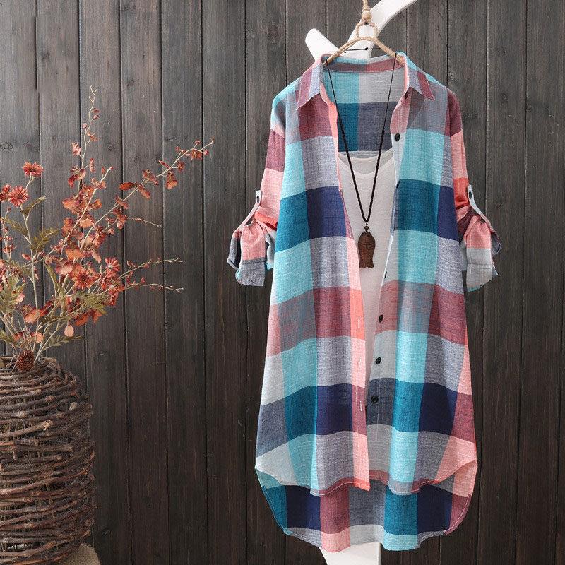 Comfortable women's oversized plaid shirt, a longline button-up blouse ideal for versatile casual & layered looks.