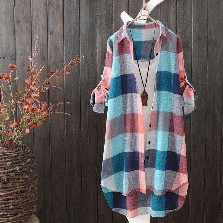 Comfortable women's oversized plaid shirt, a longline button-up blouse ideal for versatile casual & layered looks.