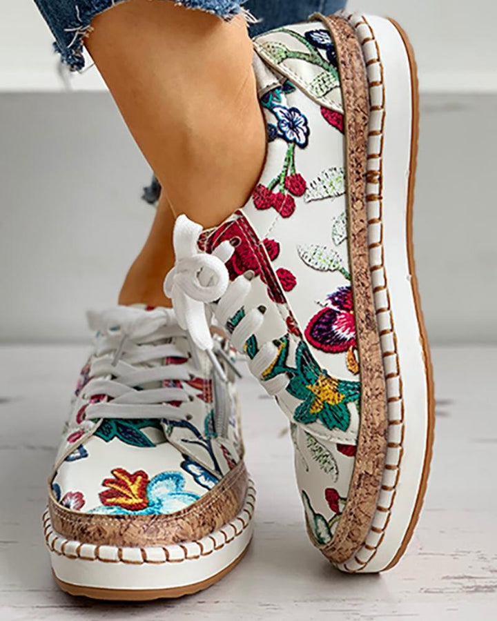 Close-up of the floral design on women's orthopedic athletic shoes, highlighting the vibrant pattern.