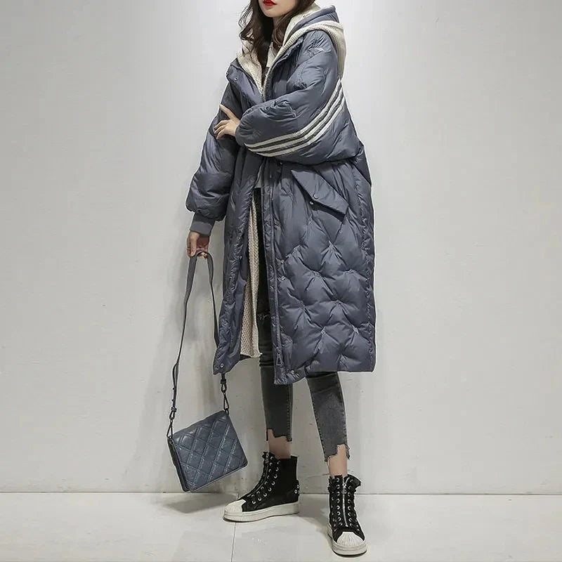 Elegant women's hooded winter puffer jacket, ideal for cold weather, offering style & warmth.