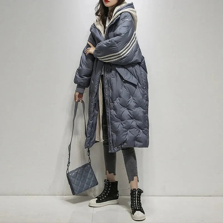 Elegant women's hooded winter puffer jacket, ideal for cold weather, offering style & warmth.