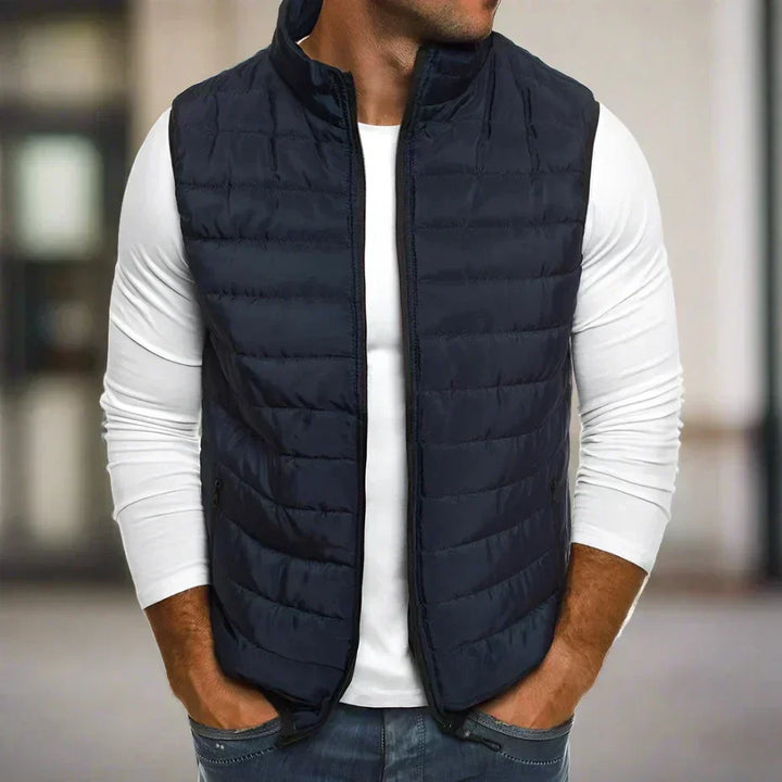 Sleek men's lightweight padded gilet in polyester, featuring a full zip for warmth and easy layering.