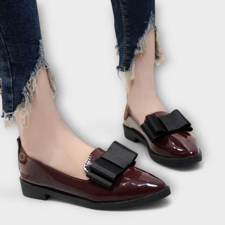 Chic navy blue women's moccasins with tassel detail, comfortable flat shoes for office or casual elegant wear.