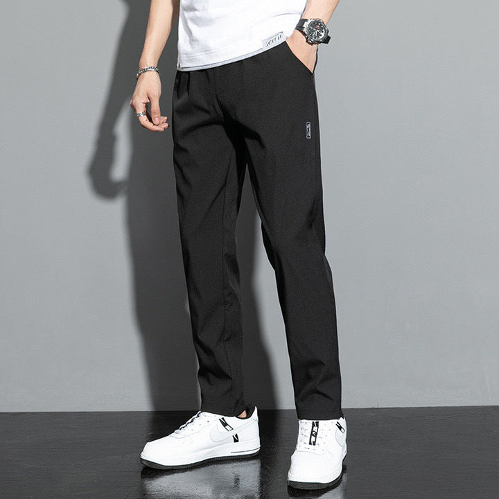 Men's comfortable straight leg pants with elastic waist, ideal for casual wear & everyday comfort. Features slash pockets.