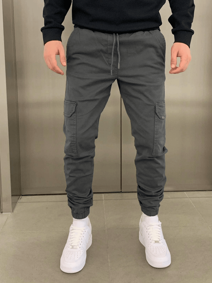 Stylish men's tie-waist cargo trousers, versatile for everyday comfort. Relaxed fit casual pants.