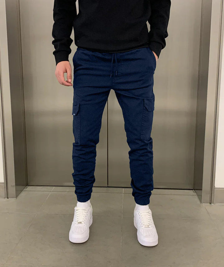 Comfortable men's utility cargo pants featuring a sleek tie-waist and relaxed fit for everyday style.