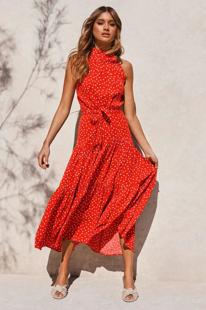 Vacation-ready polka dot maxi dress, elegant women's summer style.