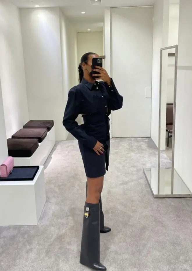 Tall fashion boots for women: glossy black, sculptural wedge, perfect for winter ensembles.