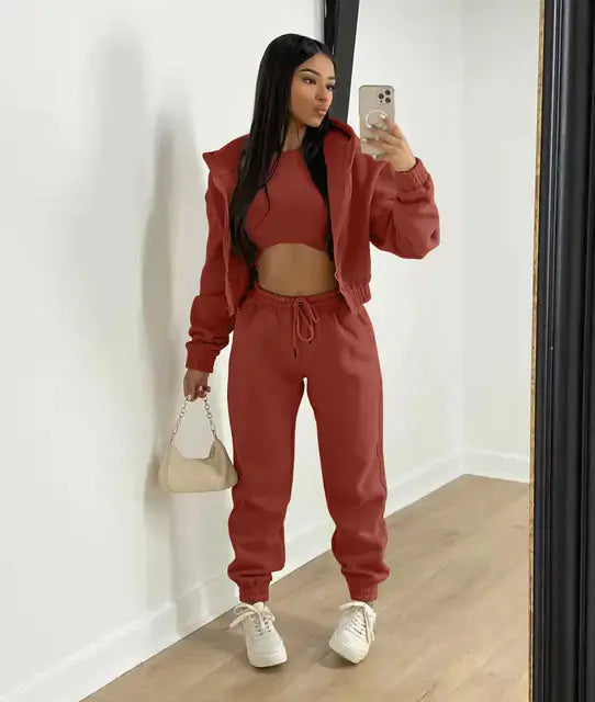 Versatile women's 3-piece outfit for travel: cropped hoodie, joggers, & bralette.