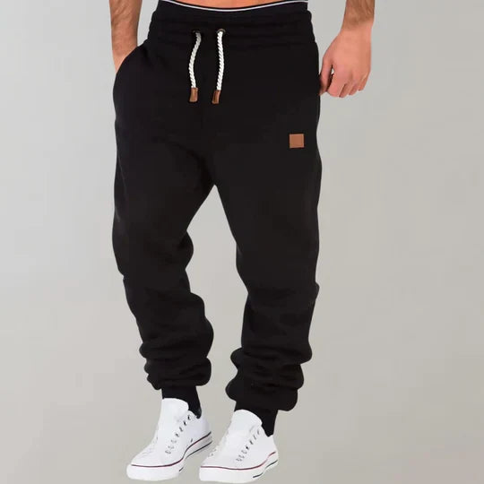 Men's ultimate comfort jogging pants, featuring soft fabric, elastic waist, and practical drawstring.