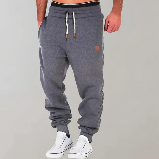 Man wearing versatile men's casual joggers, suitable for relaxed everyday wear or light physical activity.
