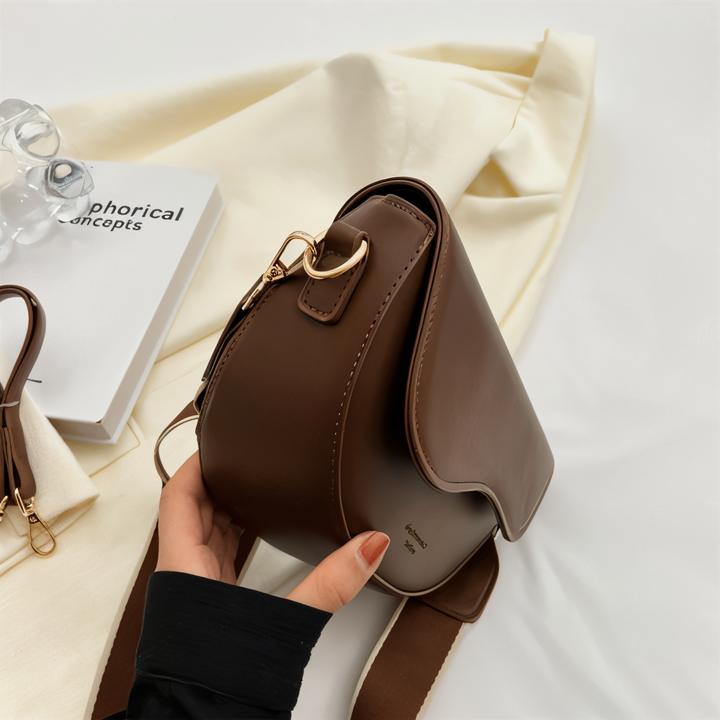 Compact women's crossbody bag with a chic design, an elegant fashion accessory for daily use.