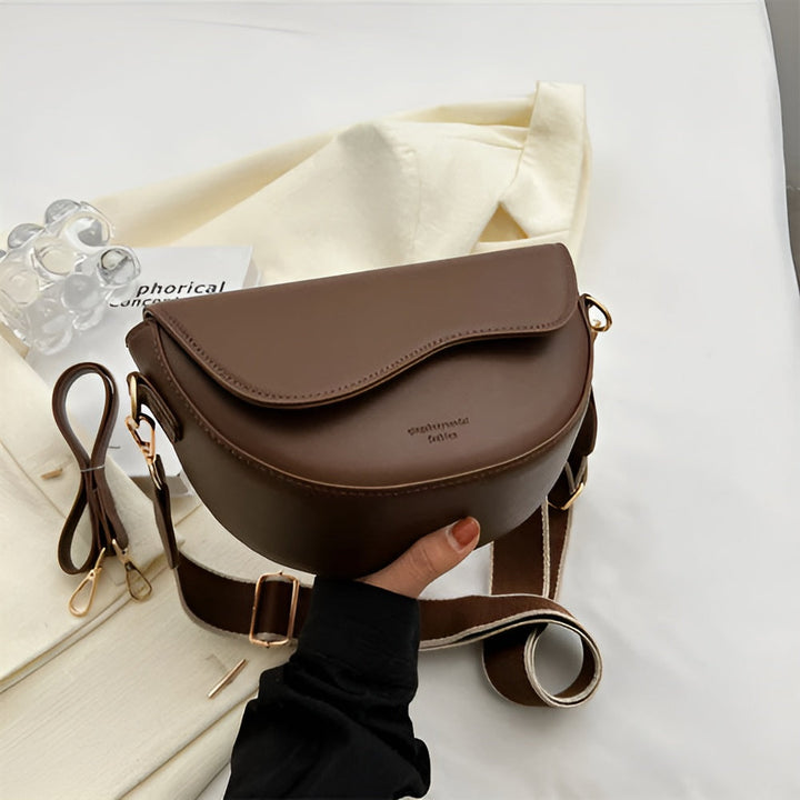 Stylish black women's crossbody bag, a compact & elegant purse for everyday fashion convenience.