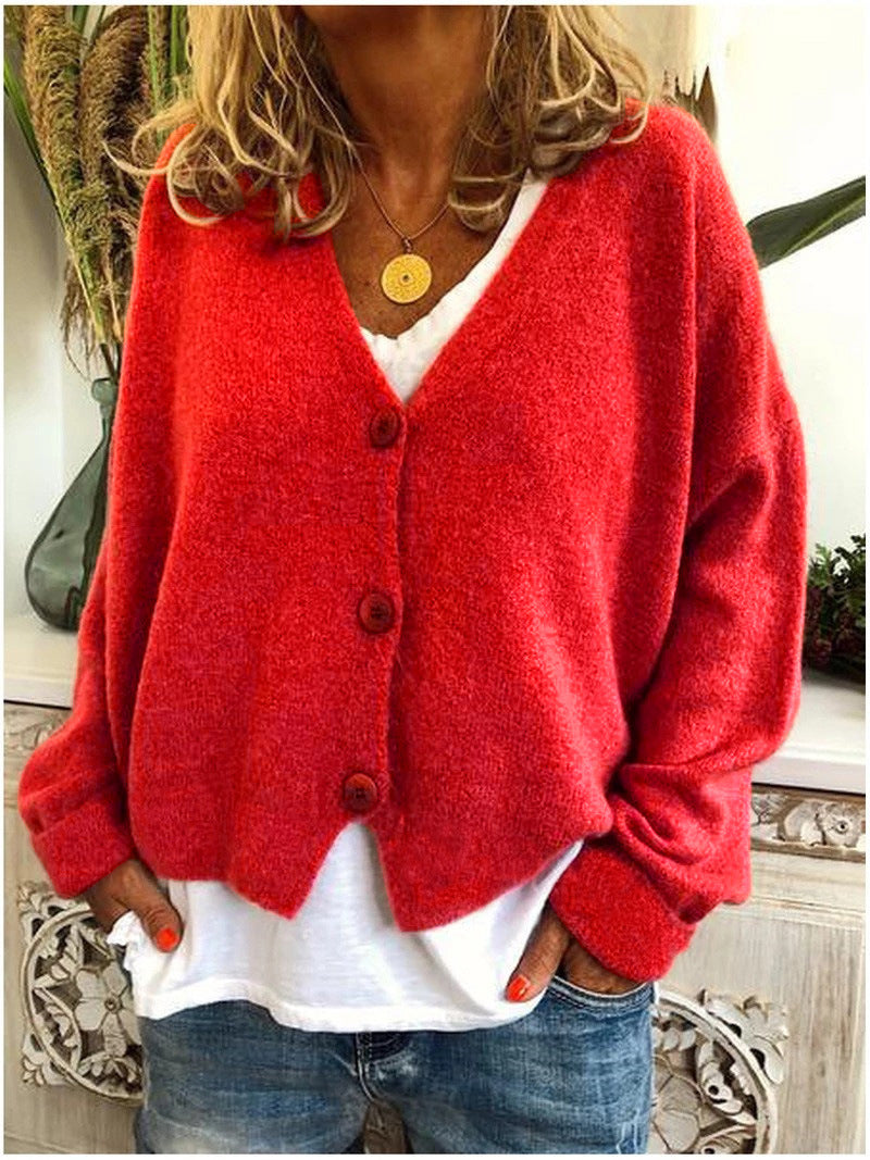 Women's long sleeve knitwear cardigan, V-neck button-front, offers chic comfort.