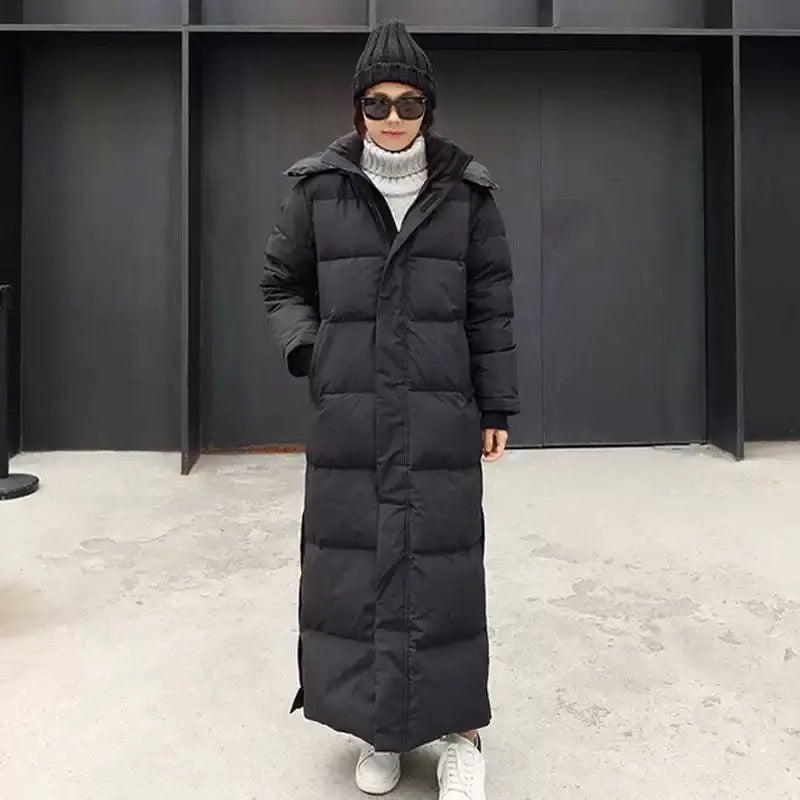 Fashionable women's long padded winter jacket. Hooded, zippered, and warm for ultimate cold weather comfort.