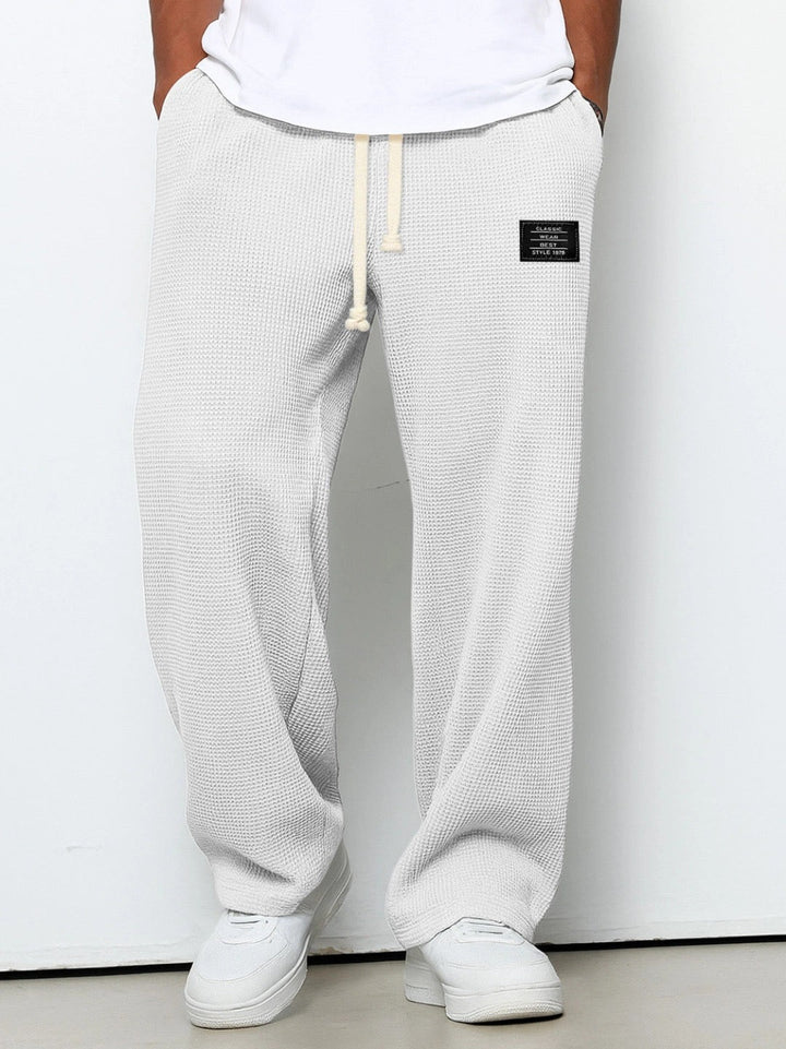 Man wearing versatile men's relaxed fit trousers with a t-shirt, perfect for comfortable casual everyday wear.