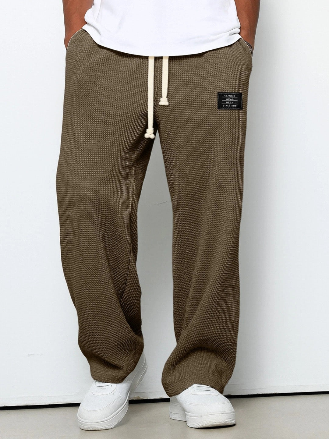 Men's relaxed everyday trousers in motion, showing flexible fabric & comfortable fit for active casual wear.