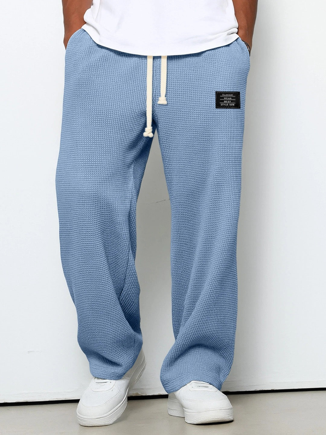 Soft, durable fabric texture of men's relaxed everyday trousers, offering ultimate comfort and quality.