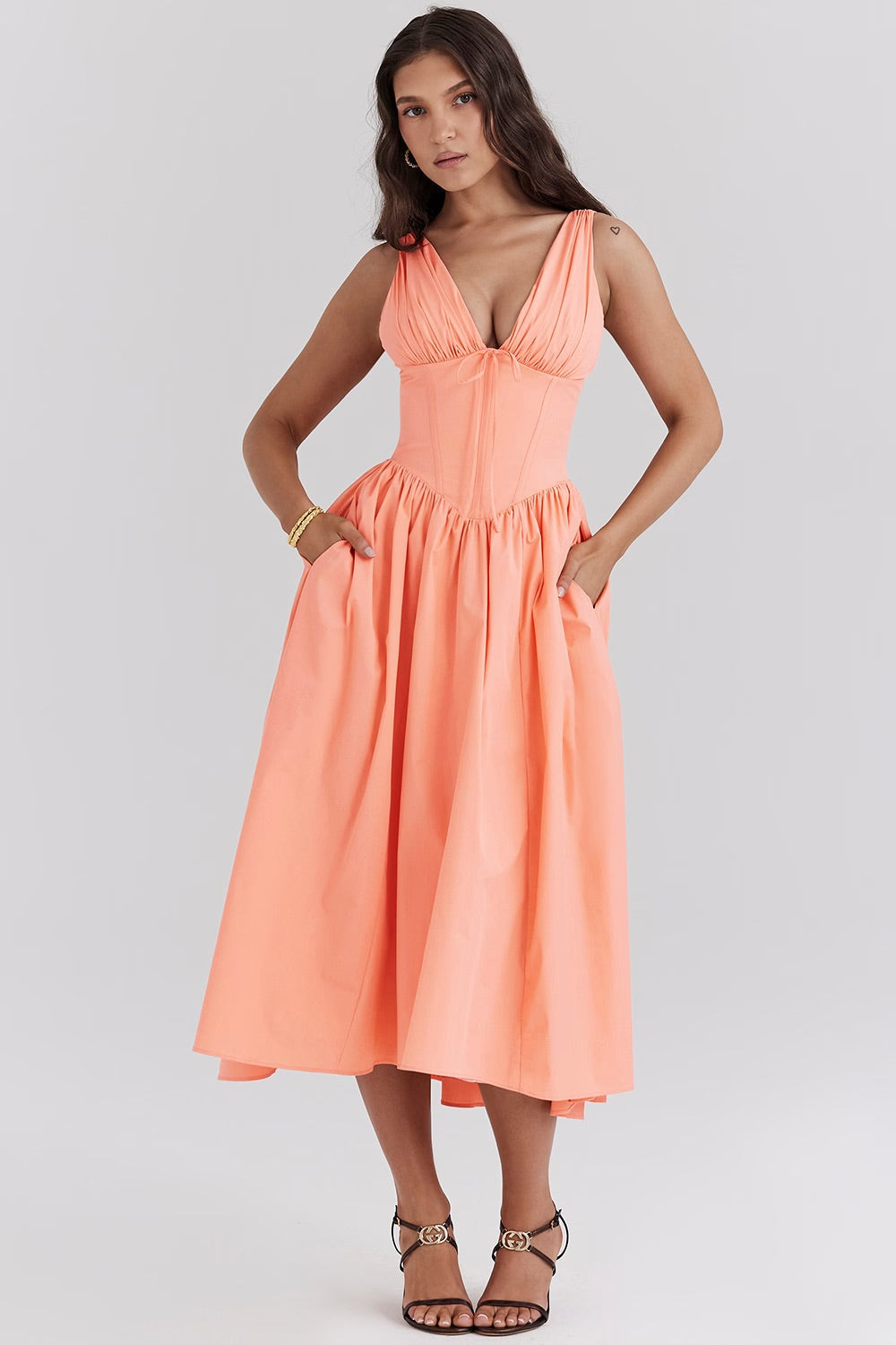 Women's flowy floral midi dress, a versatile piece for summer parties, day events, or vacation fashion.