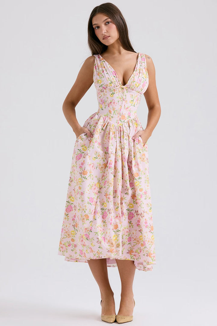 Stylish women's floral summer midi dress with a flared skirt, ideal for vacation wear or casual outings.