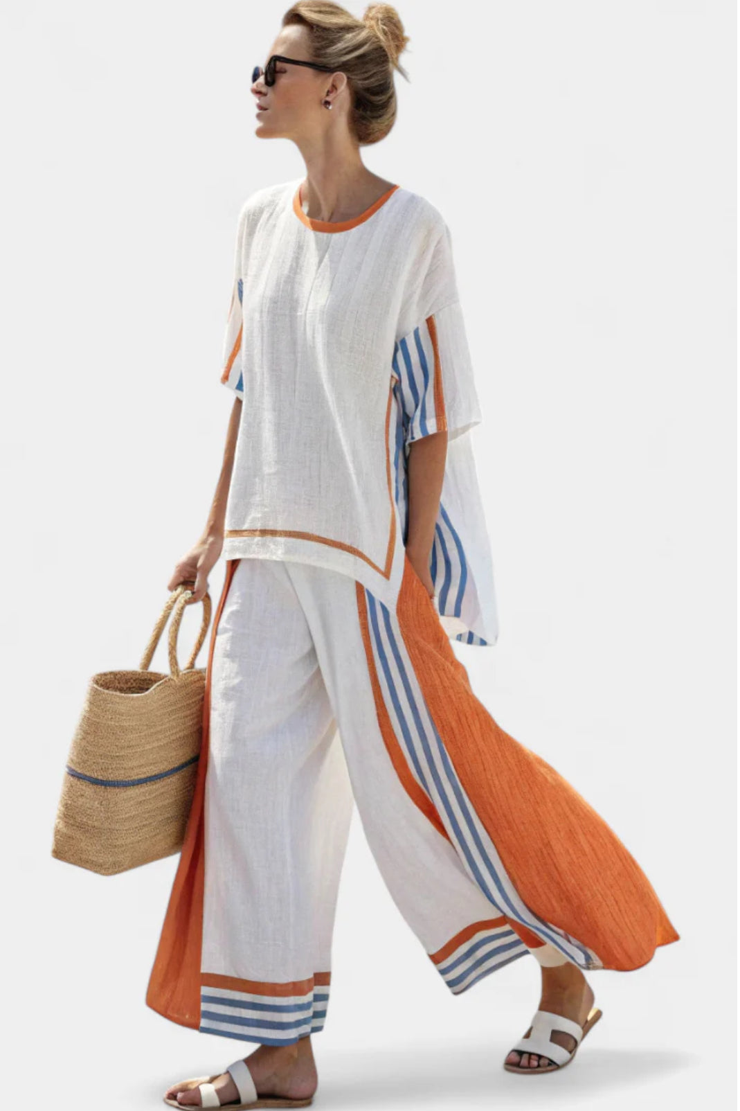 Elegant women's striped two-piece set featuring a stylish top and wide-leg pants, perfect for summer fashion.