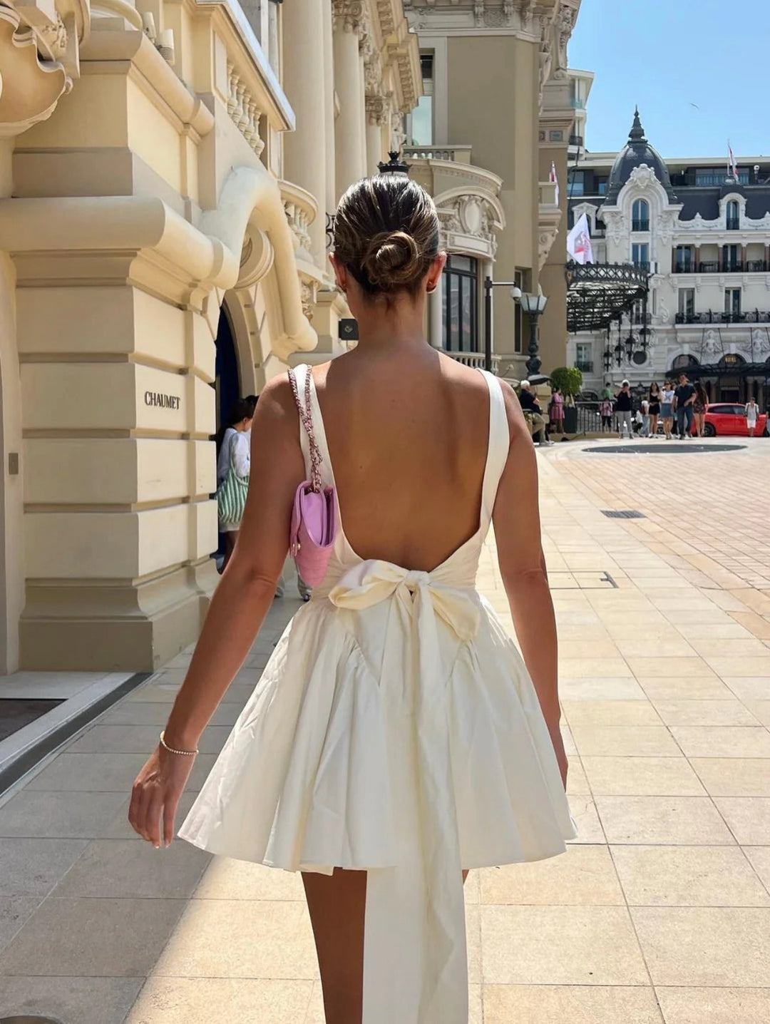 Romantic women's holiday mini dress, chic open-back design for elegant party wear.