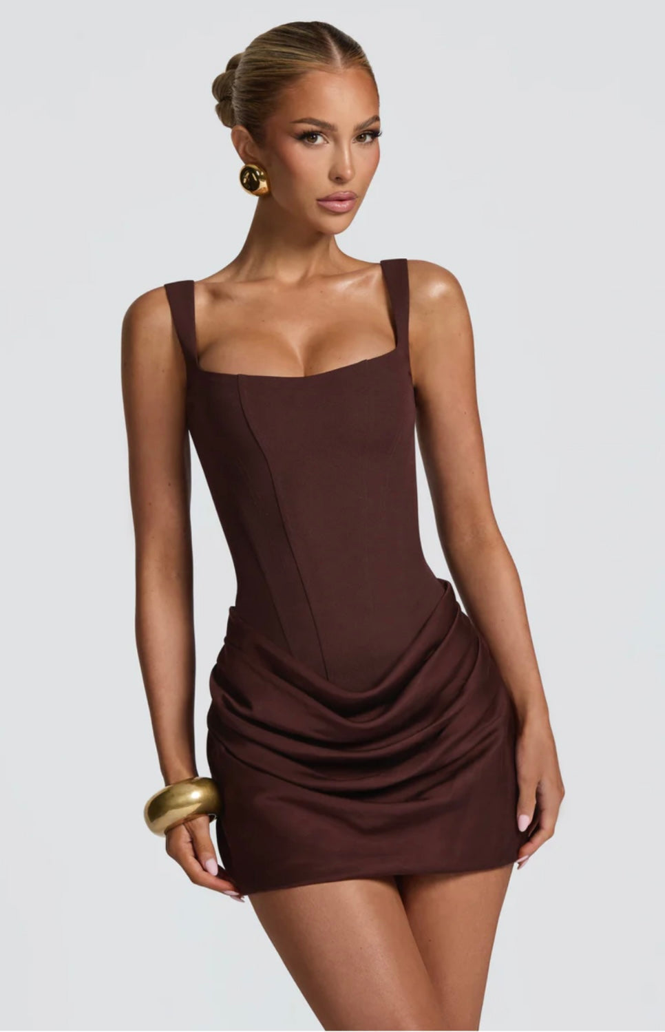 Elegant women's tailored mini dress featuring a flattering sculpted corset for special occasions.