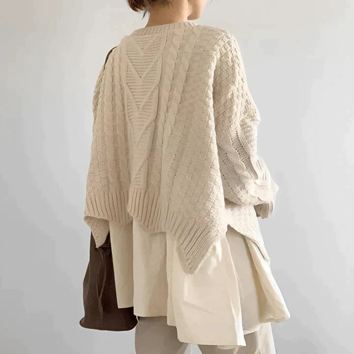 Elegant women's round neck sweater offering cozy comfort, perfect for versatile seasonal style.