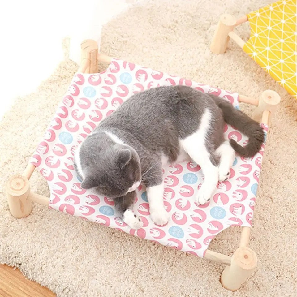 Elevated cooling cat bed, sturdy frame with breathable fabric for a relaxing summer nap. Easy clean.