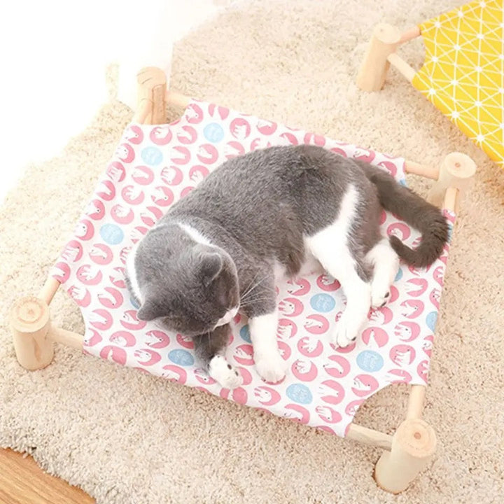Elevated cooling cat bed, sturdy frame with breathable fabric for a relaxing summer nap. Easy clean.