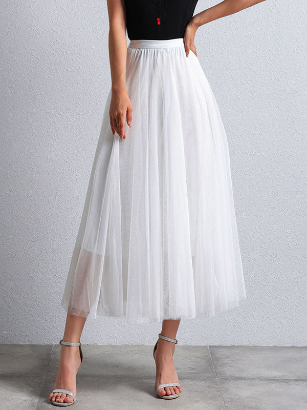 Women's flowing tutu skirt, longer midi length, puffy trapeze shape for elegant casual wear.
