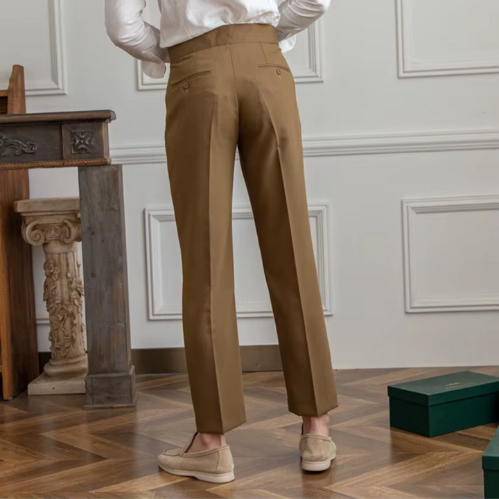 Men's tailored black pleated chinos, offering a sharp and modern silhouette.