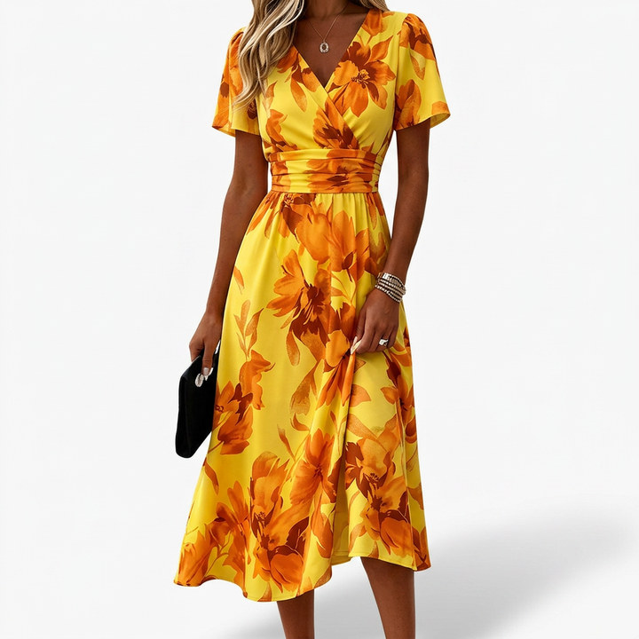 Flowy short-sleeve V-neck floral midi wrap dress. Ideal elegant casual wear for women's spring/summer fashion.