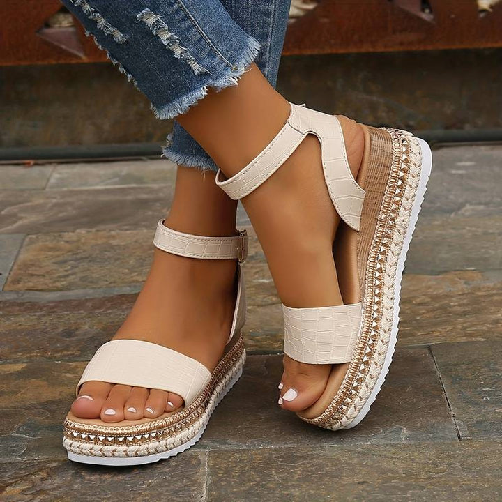 Stylish apricot women's platform sandals, featuring an adjustable ankle strap and open toe design.