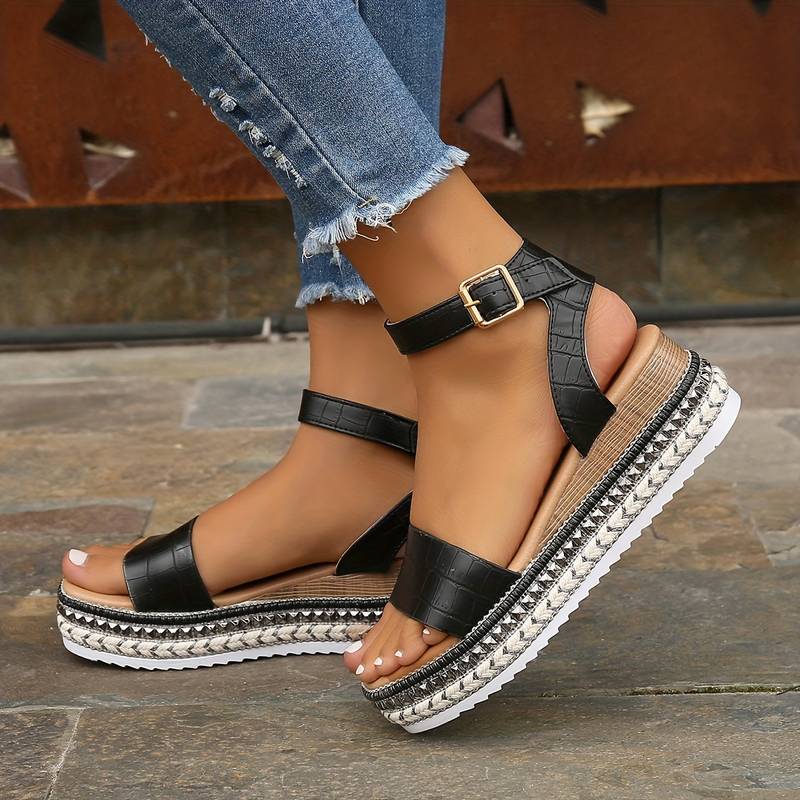 Chic black women's platform strap sandals, great for casual outings and comfortable summer wear.