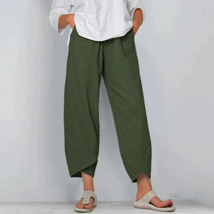Detail shot of the chic tulip hem and wide leg on versatile women's balloon pants, great for holiday wear.