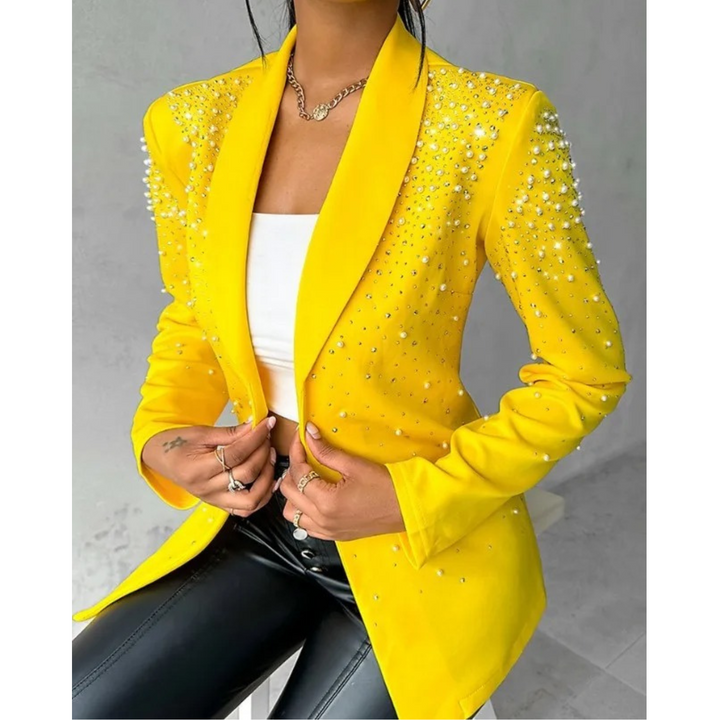 Stylish women's slim blazer featuring pearl details, ideal for business casual or elegant evening attire.