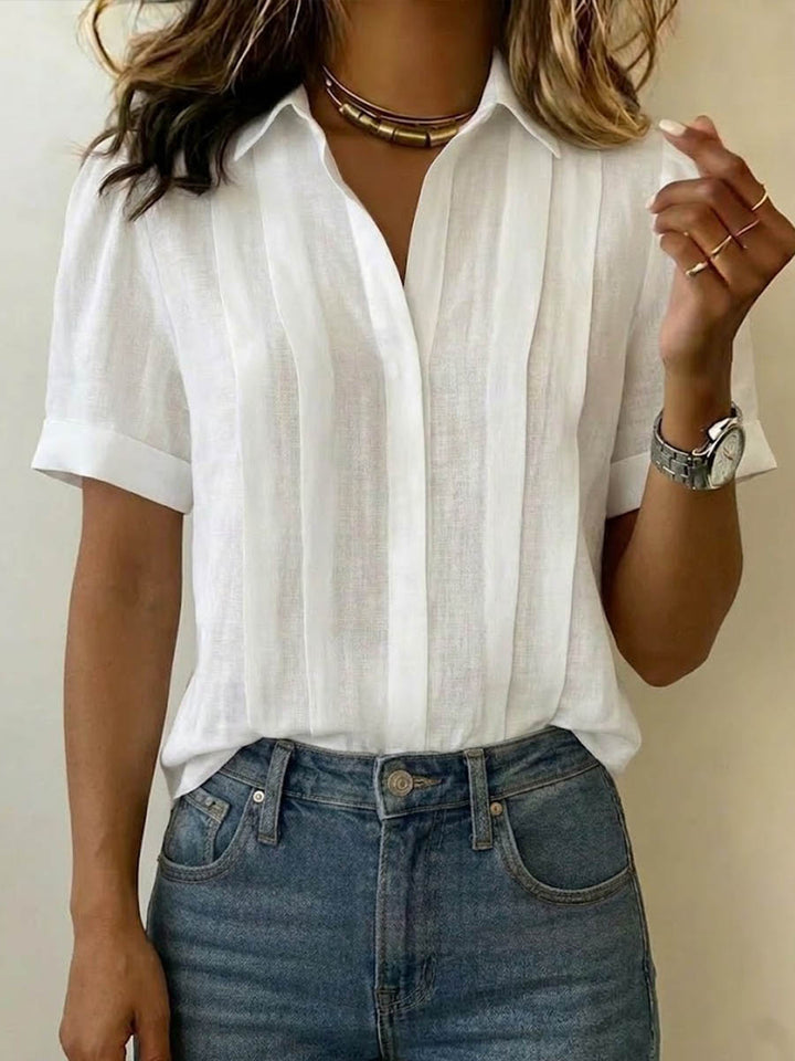Women's breezy short-sleeve blouse, effortlessly stylish for casual elegant summer and everyday wear.