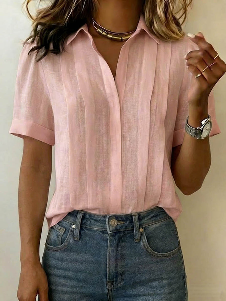 Comfortable women's short-sleeve top. Breezy summer blouse, versatile for casual or classic everyday style.