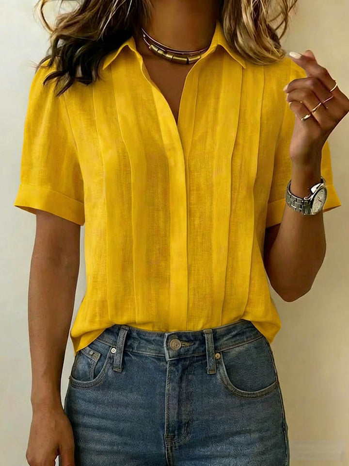 Effortless women's breezy short-sleeve blouse. A versatile summer top for casual elegance.