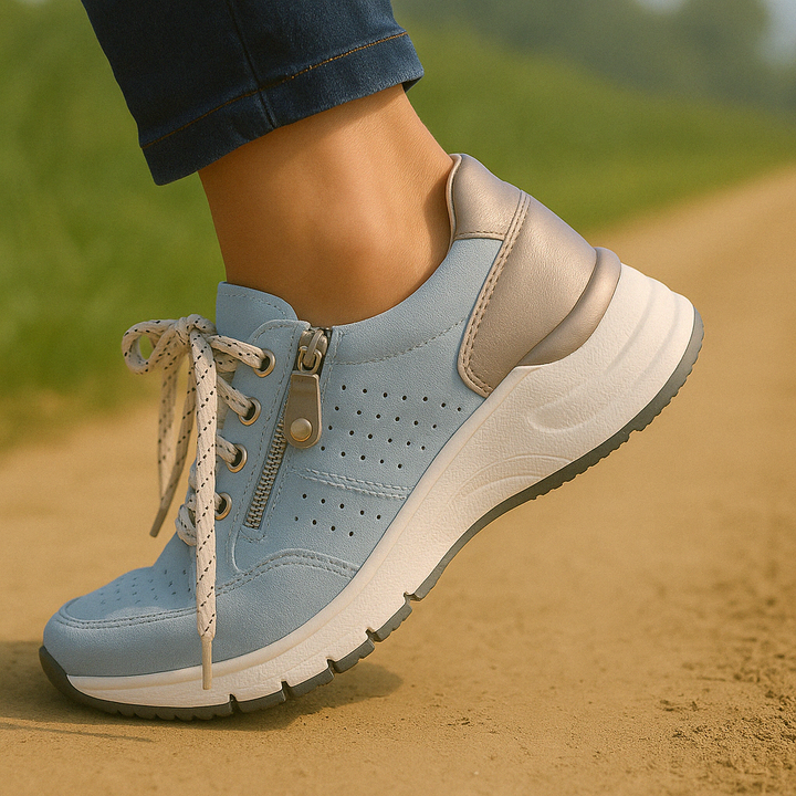 Stylish women's platform wedge sneakers featuring lace-up front & convenient side zip.