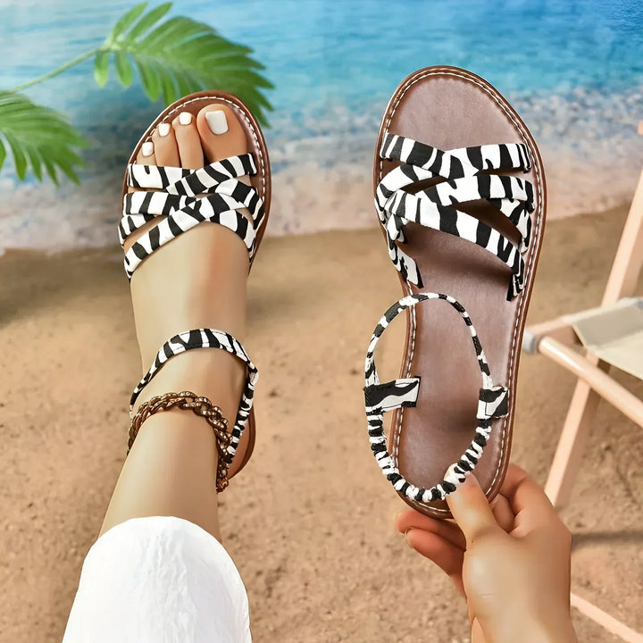 Elegant women's animal print summer flats. Fashionable, comfortable slip-on shoes with a timeless design.