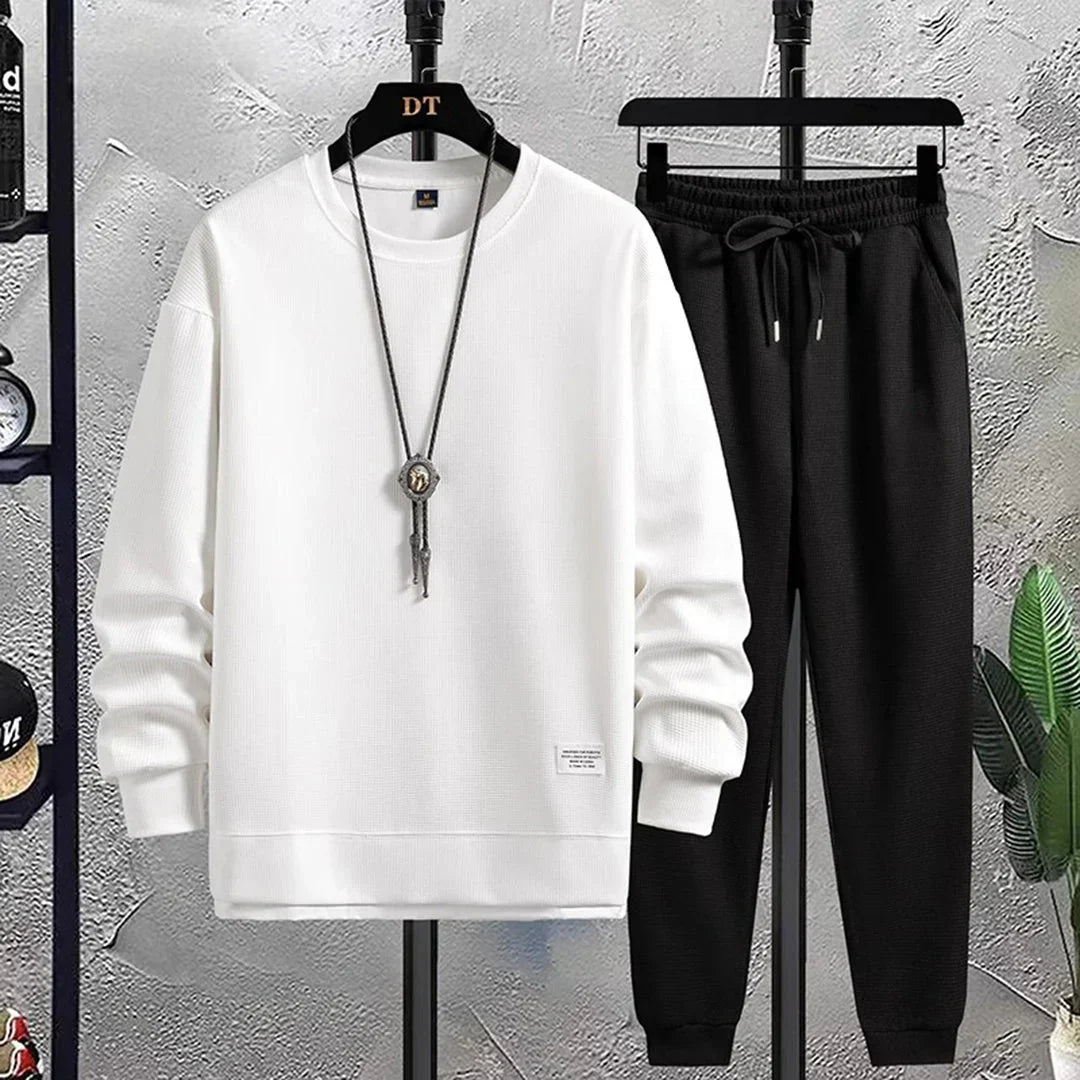 Men's relaxed fit sporty tracksuit. Two-piece pullover set offers ultimate comfort & casual style.