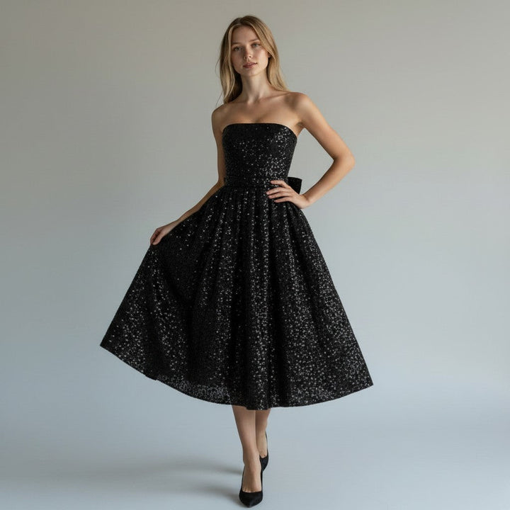 Elegant women's sequin midi dress with a flowing silhouette, perfect for evening wear & special occasions.